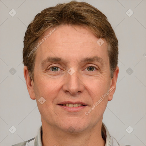 Joyful white adult male with short  brown hair and grey eyes