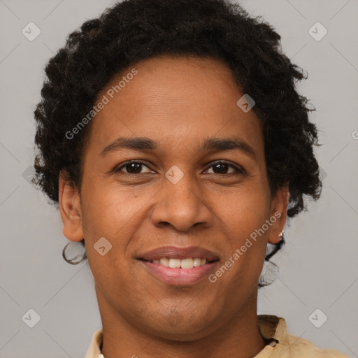 Joyful black adult female with short  brown hair and brown eyes