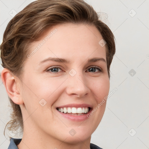 Joyful white young-adult female with medium  brown hair and blue eyes