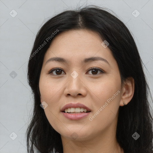 Joyful white young-adult female with long  brown hair and brown eyes