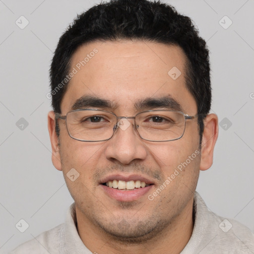 Joyful white young-adult male with short  black hair and brown eyes