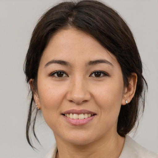 Joyful white young-adult female with medium  brown hair and brown eyes