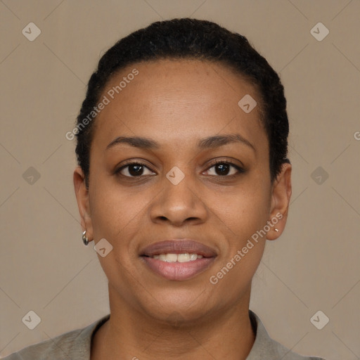 Joyful black young-adult female with short  black hair and brown eyes