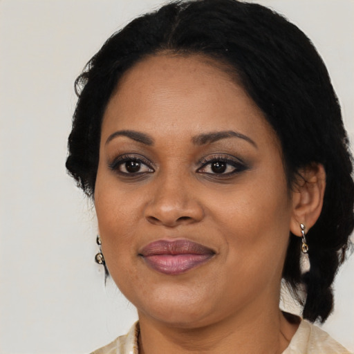 Joyful black adult female with medium  black hair and brown eyes