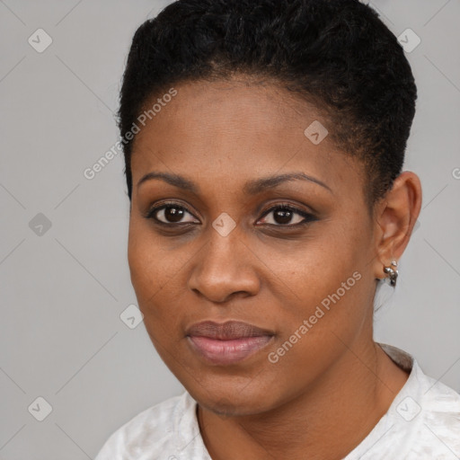 Joyful black young-adult female with short  black hair and brown eyes