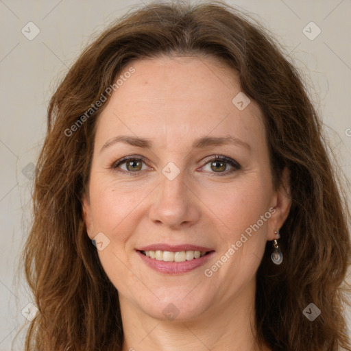 Joyful white adult female with long  brown hair and green eyes