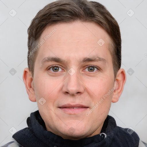 Joyful white adult male with short  brown hair and grey eyes