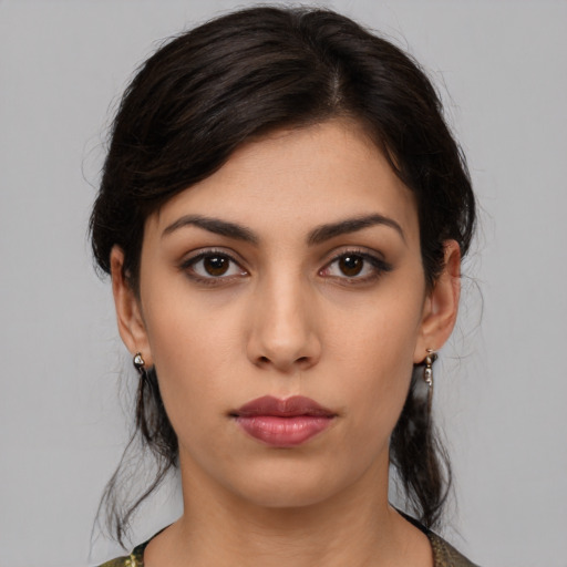 Neutral white young-adult female with medium  black hair and brown eyes