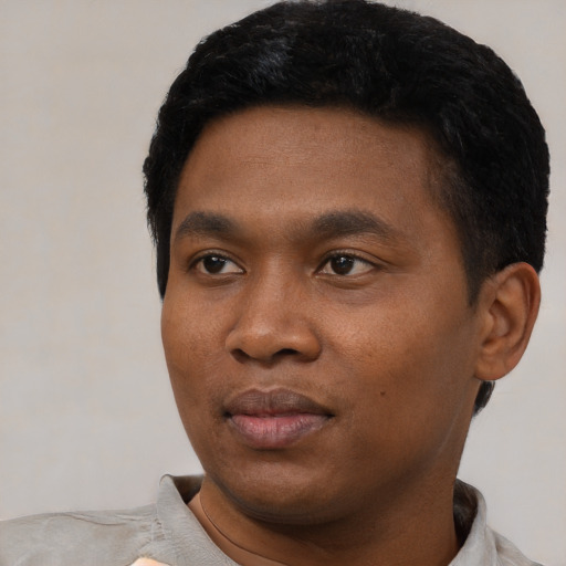 Neutral black young-adult male with short  black hair and brown eyes