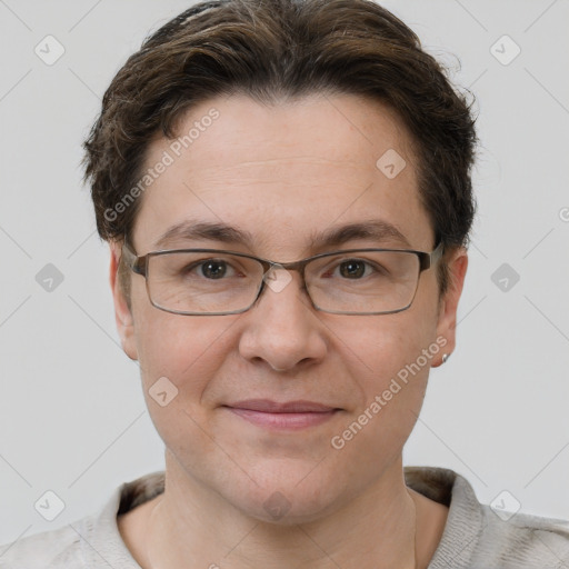 Joyful white adult female with short  brown hair and brown eyes