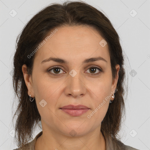 Joyful white adult female with medium  brown hair and brown eyes