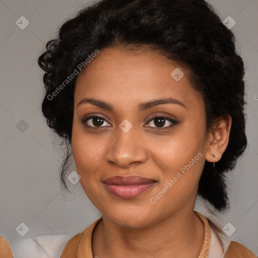 Joyful black young-adult female with long  black hair and brown eyes