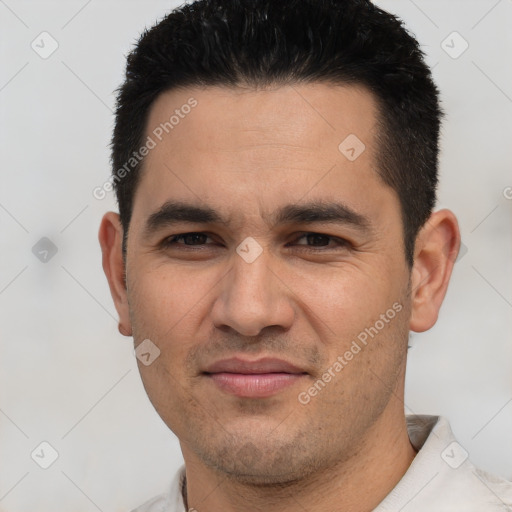 Joyful white young-adult male with short  black hair and brown eyes