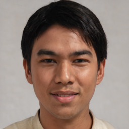 Joyful asian young-adult male with short  black hair and brown eyes