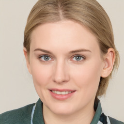 Joyful white young-adult female with medium  brown hair and blue eyes