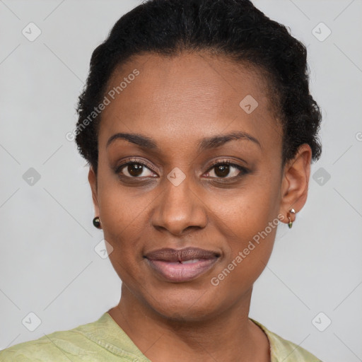 Joyful black young-adult female with short  black hair and brown eyes