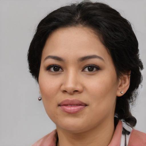 Joyful asian young-adult female with medium  brown hair and brown eyes
