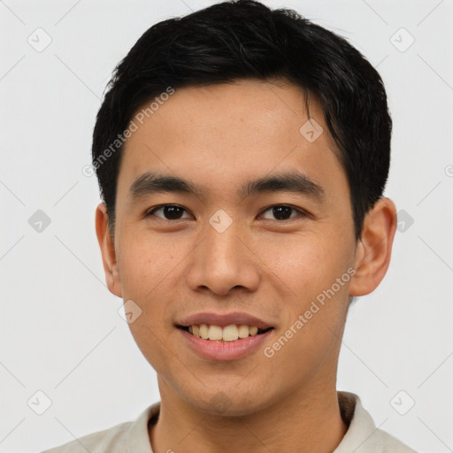 Joyful asian young-adult male with short  black hair and brown eyes