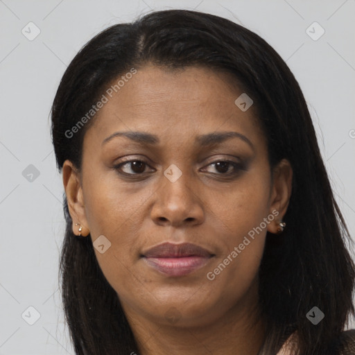 Joyful black adult female with long  brown hair and brown eyes