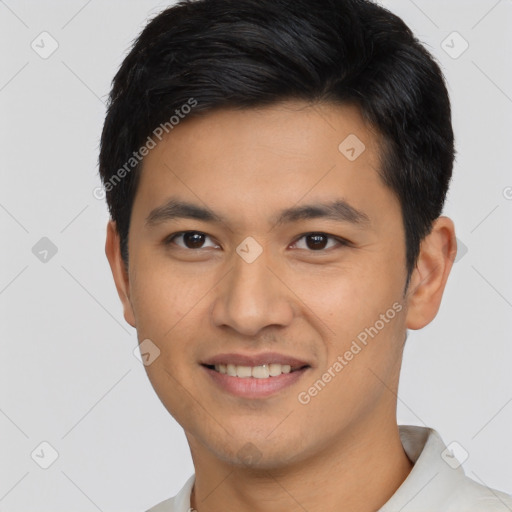 Joyful asian young-adult male with short  brown hair and brown eyes