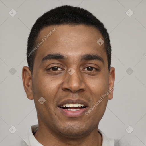 Joyful black young-adult male with short  brown hair and brown eyes