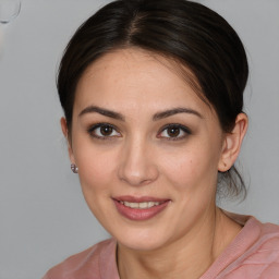 Joyful white young-adult female with medium  brown hair and brown eyes