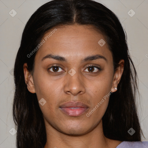 Joyful latino young-adult female with long  brown hair and brown eyes