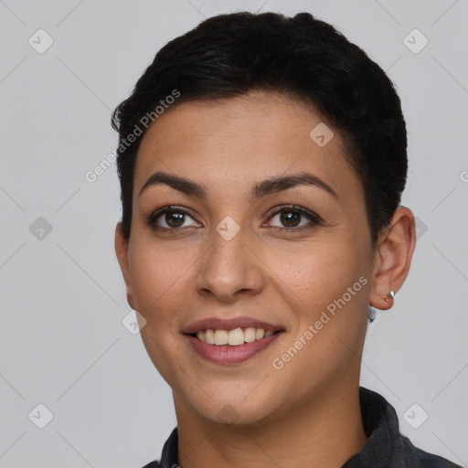 Joyful latino young-adult female with short  brown hair and brown eyes