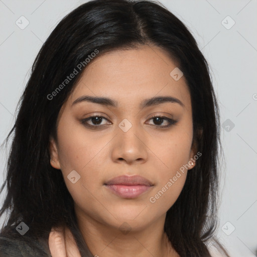 Joyful latino young-adult female with long  brown hair and brown eyes