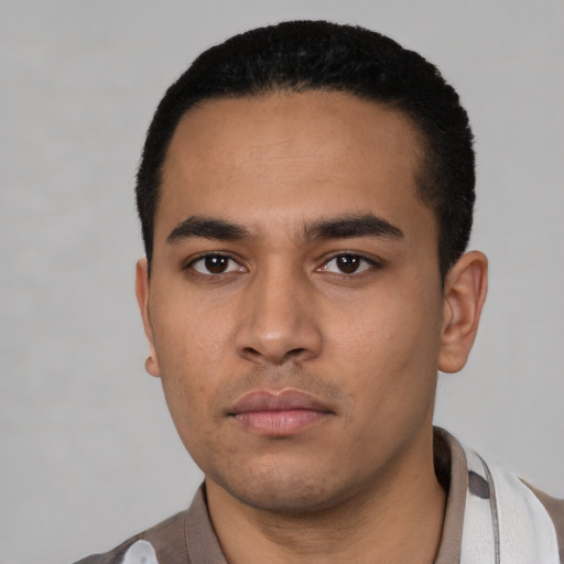 Neutral latino young-adult male with short  black hair and brown eyes