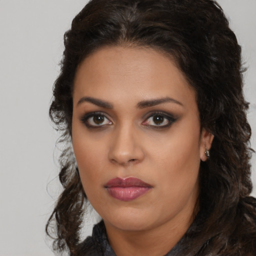Neutral latino young-adult female with medium  brown hair and brown eyes