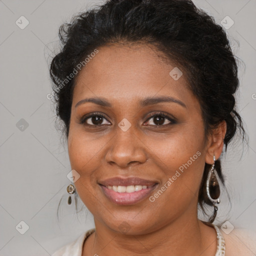 Joyful black young-adult female with medium  brown hair and brown eyes