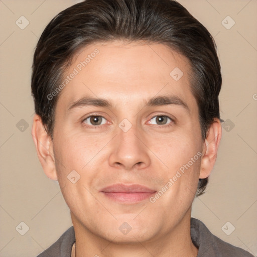 Joyful white adult male with short  brown hair and brown eyes