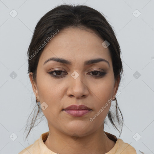 Joyful latino young-adult female with medium  brown hair and brown eyes