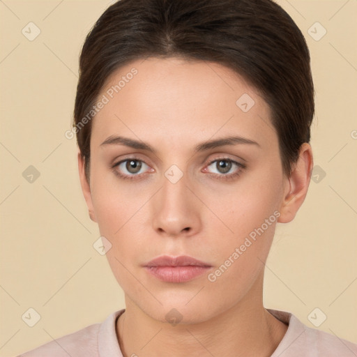 Neutral white young-adult female with short  brown hair and brown eyes