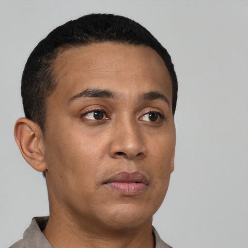 Neutral latino young-adult male with short  brown hair and brown eyes