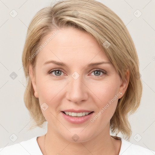 Joyful white young-adult female with medium  brown hair and blue eyes