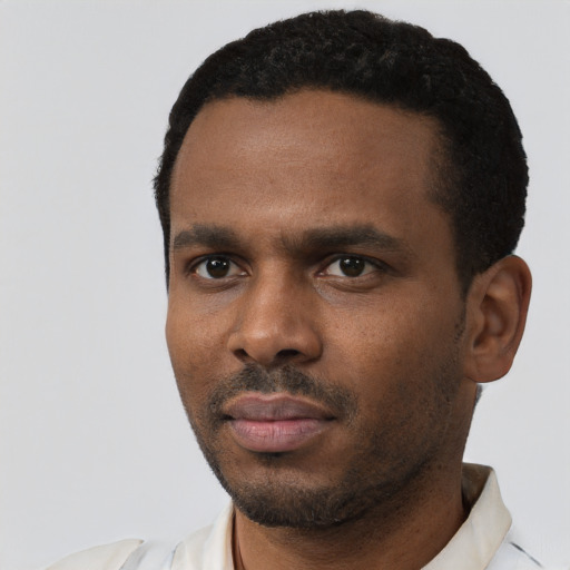 Neutral black young-adult male with short  black hair and brown eyes