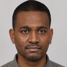 Neutral black young-adult male with short  black hair and brown eyes