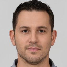 Neutral white young-adult male with short  brown hair and brown eyes