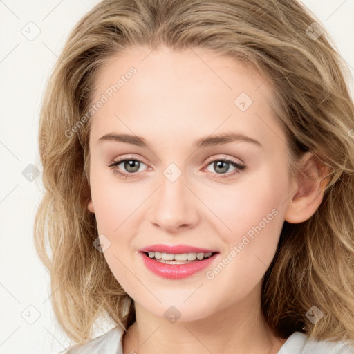 Joyful white young-adult female with long  brown hair and blue eyes