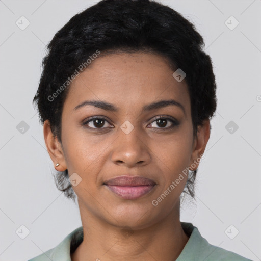 Joyful black young-adult female with short  black hair and brown eyes