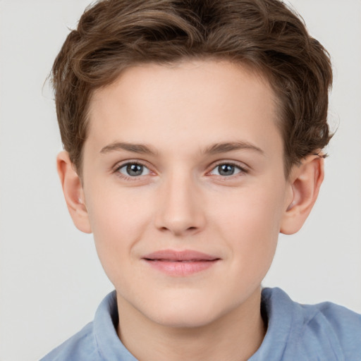 Joyful white child male with short  brown hair and brown eyes