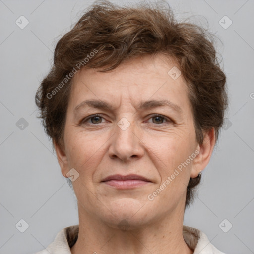 Joyful white adult female with short  brown hair and brown eyes