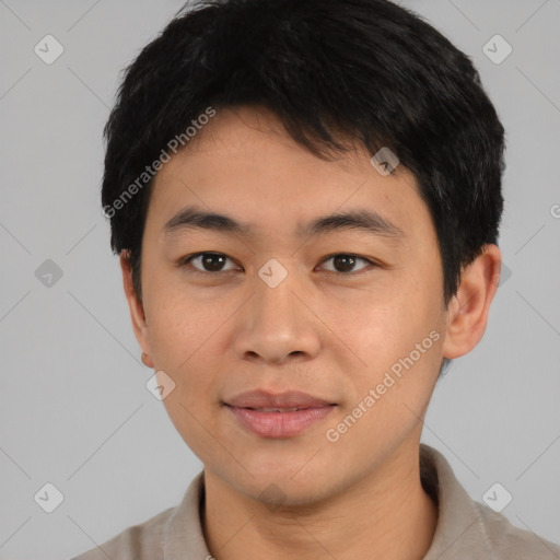 Joyful asian young-adult male with short  black hair and brown eyes