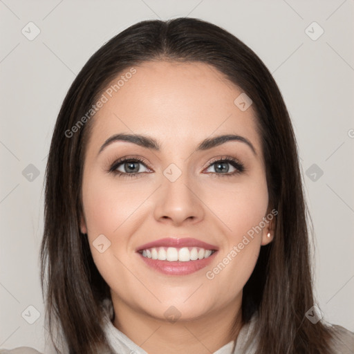 Joyful white young-adult female with long  brown hair and brown eyes