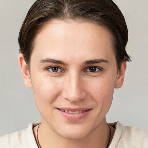 Joyful white young-adult female with short  brown hair and brown eyes