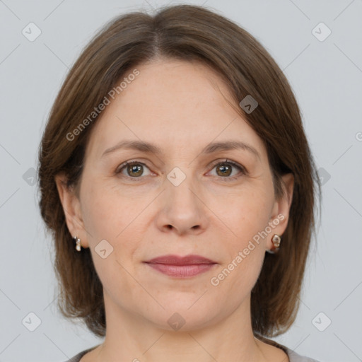 Joyful white adult female with medium  brown hair and grey eyes