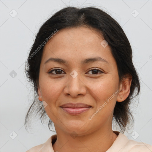 Joyful latino young-adult female with medium  brown hair and brown eyes