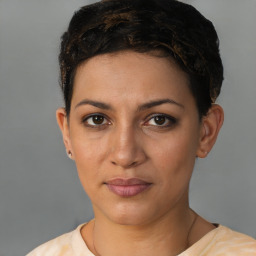 Joyful latino young-adult female with short  brown hair and brown eyes